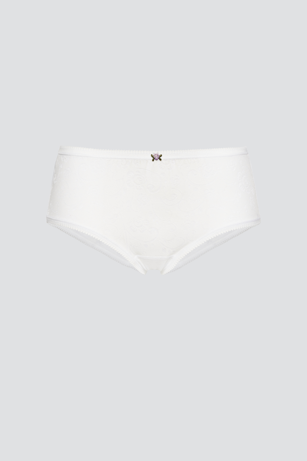 Produktbild Vorderseite Hüft-Slip von Comazo in der Farbe Weiß aus 100% Baumwolle mit zartem Stickblümchen.