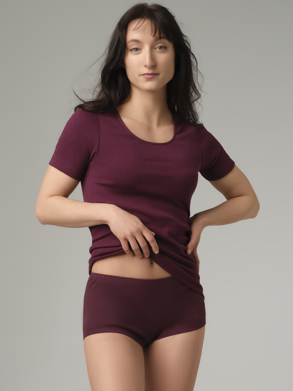 Front view 2: Woman wearing a Fairtrade panty from Comazo in burgundy, made from 100% cotton in fine-rib quality.