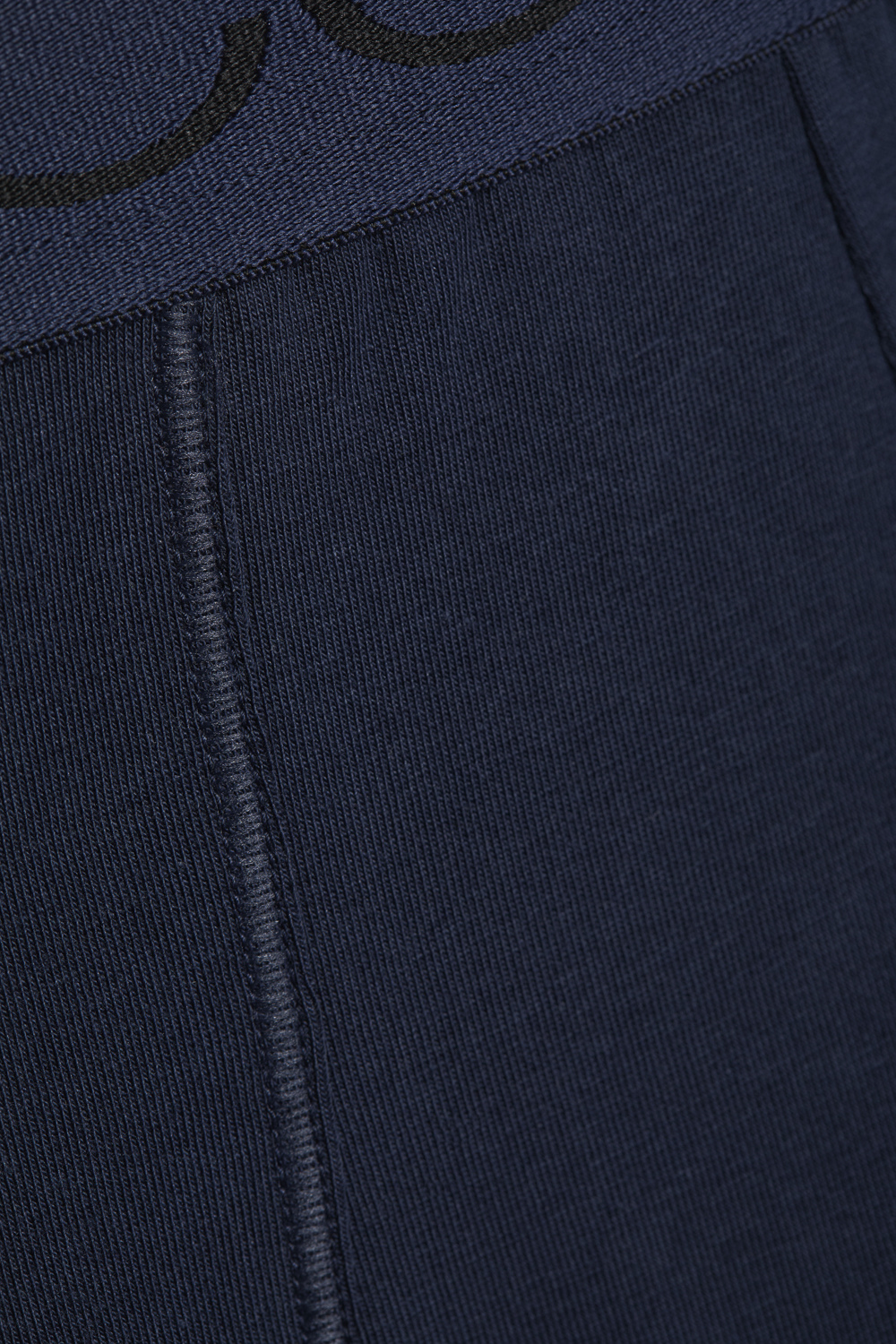 Detail view of Comazo men's trunks in navy