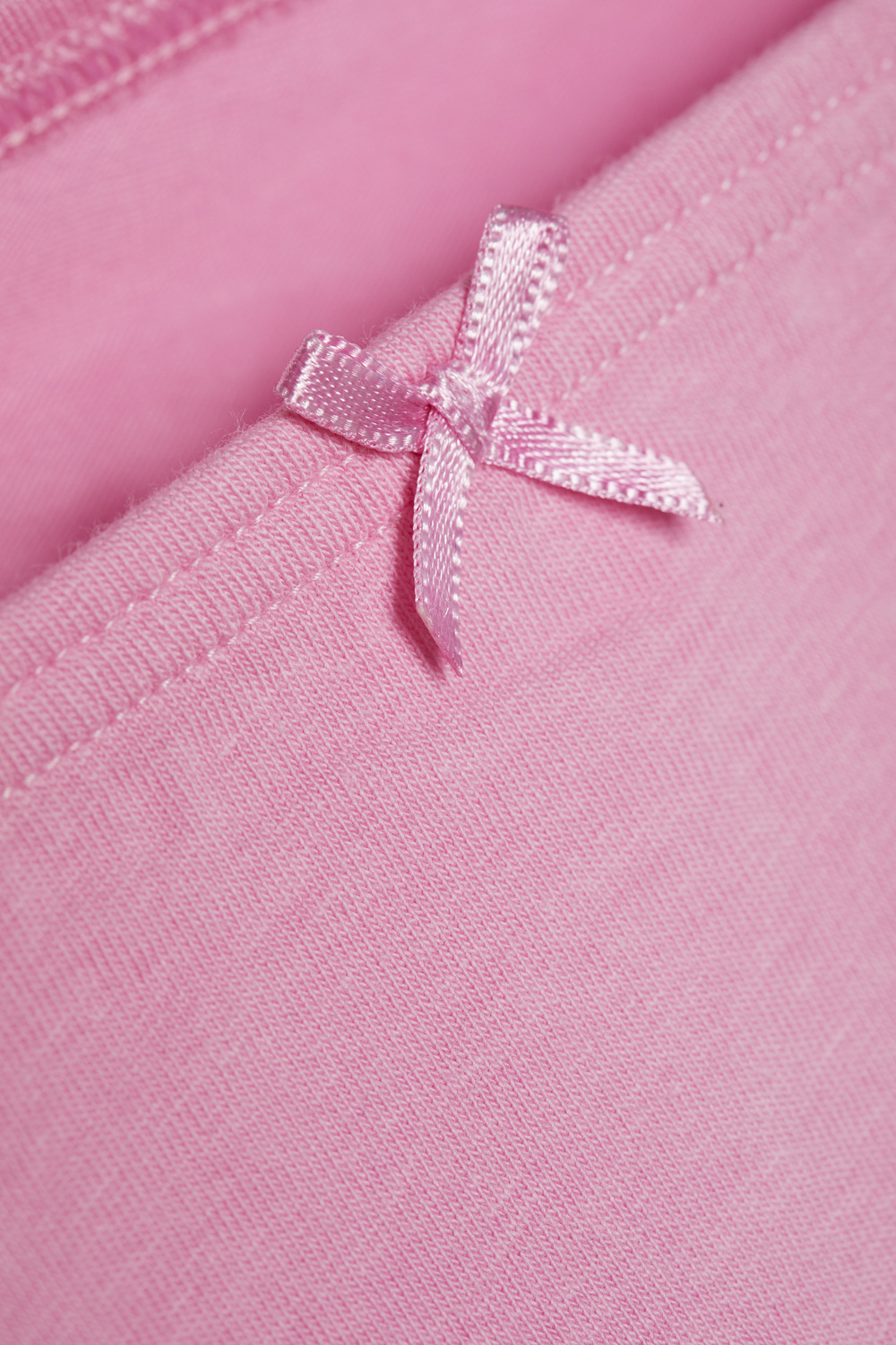 Close-up image of the Comazo girls' slip in candy color.