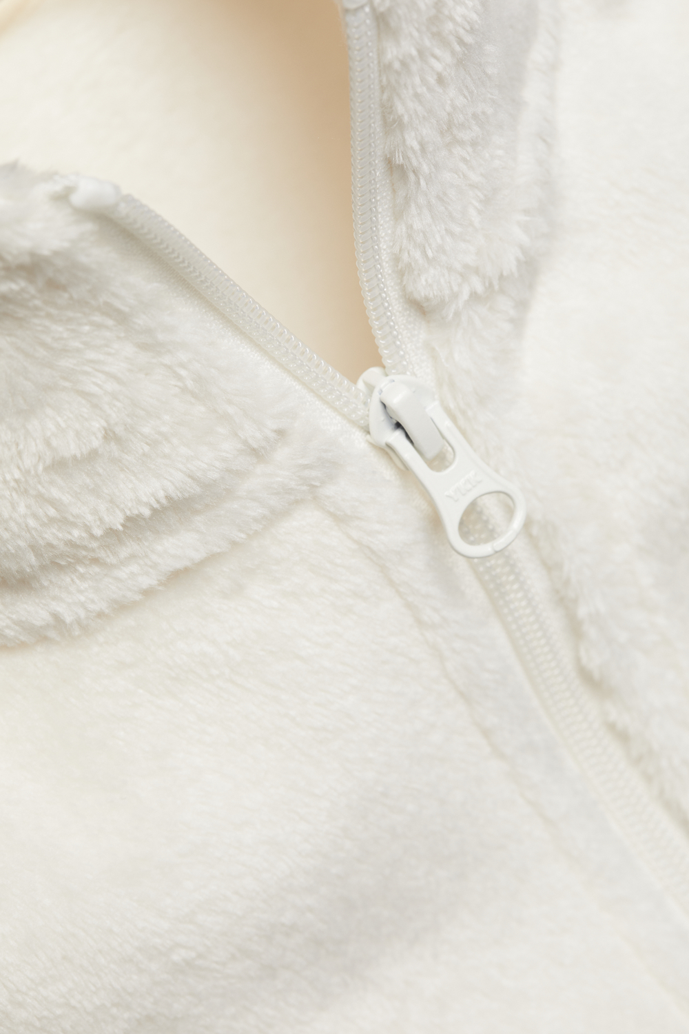 Detail image of Comazo girls' fleece jacket in offwhite.