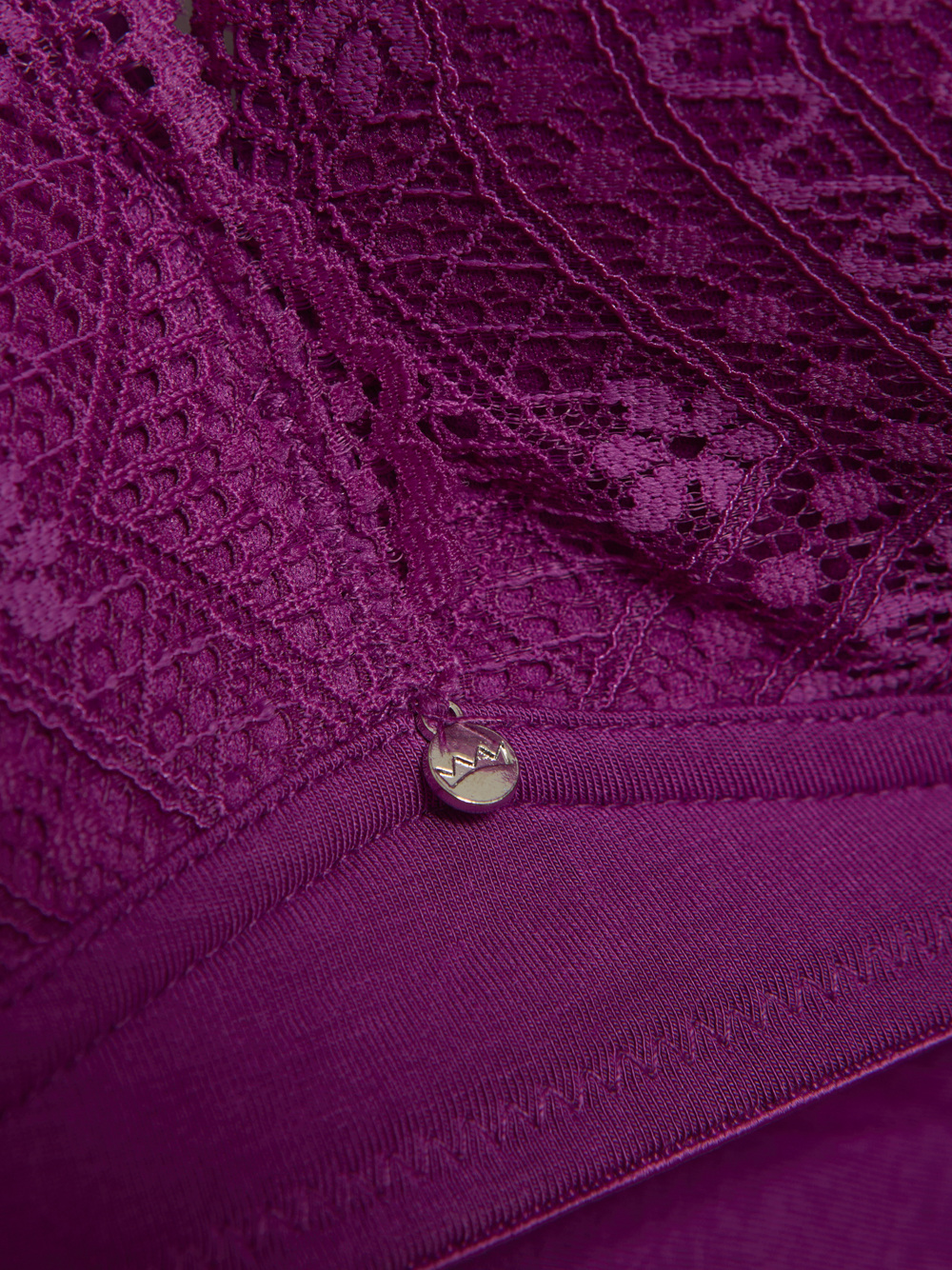 Detail image Comazo women's bra in the color Magenta, made of modal with lace detailing.